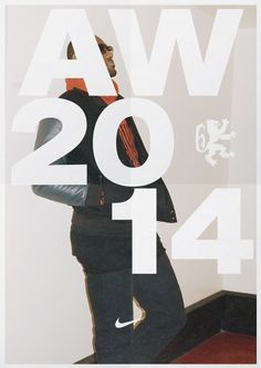 a man standing in front of a white wall with the words awa 2012 on it