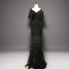 an evening gown on display in a museum