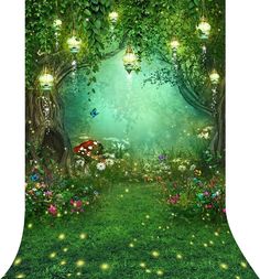 an image of a green forest scene with fairy lights and flowers on the grass,