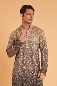 Grey and gold ombre sequin embellished kurta. Comes with plain churidar. - Aza Fashions Fitted Sequin Kurta For Designer Wear, Fitted Sequined Kurta For Diwali, Fitted Sequin Kurta For Festive Occasions, Festive Fitted Sequin Kurta, Fitted Sequin Kurta For Festivals, Wedding Straight Kurta Top With Zari Work, Fitted Sequin Sherwani For Diwali, Fitted Tops With Mirror Work For Eid, Celebration Kurta With Mirror Work And Fitted Style