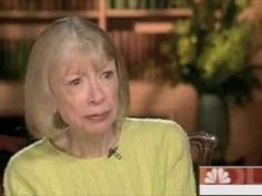 an older woman is sitting down and talking to someone on the television screen in front of her