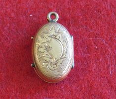 "An Awesome 1890's Victorian 14 Karat Yellow Gold Locket With Photos Necklace Pendant. Visit our shop for awesome retro photos, vintage jewelry, sports memorabilia and home decor. Size: 1/2\" across x 3/4\" high Material: 14 Karat Yellow Gold Condition: Good. Front Is Bowed In. Photos Show Wear. Year: 1890's Signed: Unsigned. Inventory #: 2280" Vintage Antique Gold Filigree Jewelry, Vintage Jewelry Pendant With Antique Finish, Vintage Antique Gold Locket Necklace Pendant, Vintage Antique Gold Pendant Locket Necklace, Antique Gold Vintage Locket Necklace Pendant, Vintage Pendant Jewelry With Antique Finish, Antique Locket Jewelry From Vintage Collection, Collectible Historical Jewelry With Antique Finish, Collectible Antique Finish Historical Jewelry