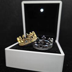 Silver ring shaped like a crown! Different sizes for different variants available: King's Ring Silver: 7 / 8 / 9 King's Ring Gold: 9 / 10 / 11 Queen's Ring Silver: 7 / 8 / 9 Queen's Ring Gold: 7 / 8 / 9 Material: 925 Sterling Silver CZ Diamonds Stainless Steel Crown Design Open Ring Jewelry Gift, Crown Design Open Promise Ring, Promise Ring Jewelry With Crown Design And Open Shape, Adjustable Crown Design Wedding Rings, Sterling Silver Crown Ring, Sterling Silver Crown Design Ring, Adjustable Crown Design Jewelry As Gift, Adjustable Crown Design Jewelry For Gift, Silver Crown Design Ring Gift