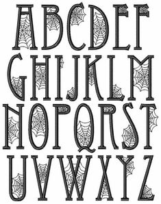 the alphabet is decorated with spider webs