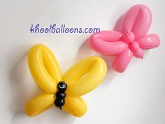 two balloons shaped like flowers on a white surface with the words balloon animals above them