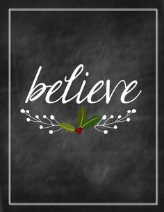 a chalkboard with the words believe written in white lettering and holly on it, surrounded by berries