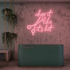 a purple neon sign that says shop it like it's hot on the wall