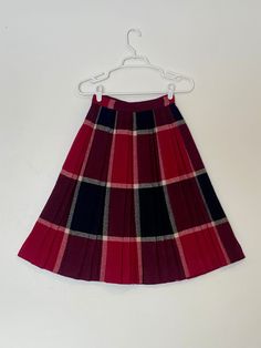 "Vintage 1950s/60s pleated circle skirt.  This skirt is made from a thick, wool-like material and features a metal zip closure. Excellent condition and the perfect addition to any vintage-lovers wardrobe.  Measurements (taken flat):     - Waist: 12\"    - Length: 25\"" Vintage Full Skirt With Accordion Pleats, Retro A-line Skirt For Winter, Vintage Pleated Plaid Skirt, Vintage Pleated Skirt For Fall, Retro Accordion Pleated Skirt For Fall, Vintage Accordion Pleats Skirt For Fall, Vintage Wool Lined Skirt, Vintage Full Pleated Skirt For Fall, Vintage Pleated Skirt For Winter