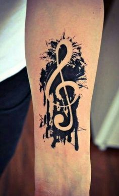 a tattoo with a treble on it