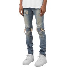 These jeans feature a unique high street wash that creates a cool, faded look. The distressed detailing adds a touch of edginess to the design, making it perfect for anyone who loves to make a statement with their fashion choices. The stacked fit of these jeans is both trendy and flattering, creating a slimming effect that elongates your legs. Features: -80% Cotton, 20% Spandex -Mid-rise Waist -Premium denim fabric -Pre-made holes -Distressed details -Regular Fit -High Street Style Washed Blue Jeans With Frayed Hem For Streetwear, Urban Distressed Medium Wash Jeans, Urban Style Ripped Denim Jeans, Urban Style Ripped Jeans, Urban Ripped Denim Jeans, Ripped Dark Wash Jeans For Streetwear, Distressed Denim Jeans For Streetwear, Urban Distressed Denim Jeans, Urban Faded Jeans With Frayed Hem