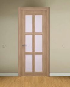 an empty room with a wooden door and hard wood floor