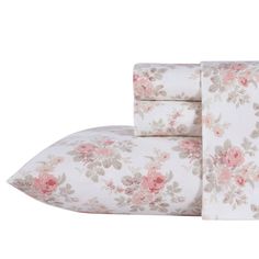 the floral sheet set is made up of two sheets and one pillowcase with pink flowers on it