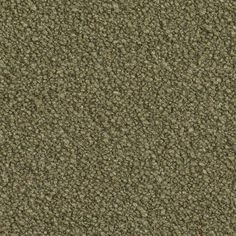 a close up view of an olive green carpet textured with small dots and lines