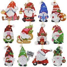 christmas ornament set with santa clause and other decorations on it's side