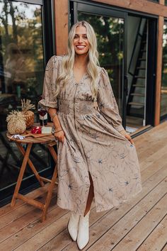 Calmer Days Floral Midi in Taupe Fall Midi Length Ditsy Floral Print Dress, Mid-length Floral Print Midi Dress For Fall, Beige Floral Print Mid-length Dress, Floral Print Midi Dress With 3/4 Sleeves For Fall, Floral Print Fall Midi Dress With 3/4 Sleeves, Denim Purse, Concert Fashion, Sweater Jumpsuit, Essential Dress