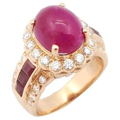 Cabochon Ruby 5.96 carats, Ruby 0.89 carat and Diamond 0.70 carat Ring set in 18K Rose Gold Settings Width: 1.2 cm Length: 1.5 cm Ring Size: 51 Total Weight: 9.93 grams "We first opened doors in 1980 when it was then situated in the vicinity of the Victory Monument; a small and modest storefront with a couple of counters. From its humble beginnings to where it stands today, our company has proven its abilities as a jeweler. Since the beginning, we have been supplying fine quality pieces to dealers, wholesalers and customers worldwide. From then till now, our business still interrelates its name with quality products and excellent service, where commitment and sincerity toward customers will always be its motto." Luxury Ruby Ring With Oval Cabochon, Luxury Ruby Ring With Cabochon Cut, Luxury Fine Jewelry Ruby Ring With Cabochon, Luxury Yellow Gold Ruby Ring Oval Cabochon, Luxury 14k Gold Ruby Cabochon Ring, Cabochon Ruby, Ruby And Diamond Ring, Diamond Ring Set, Ruby Diamond Rings