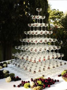 a table topped with lots of wine glasses