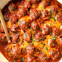 a casserole dish with meatballs and cheese in it, ready to be eaten