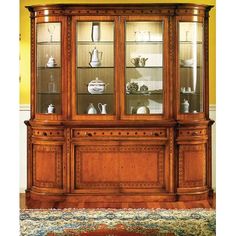 a large wooden china cabinet with glass doors