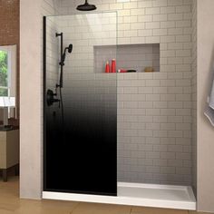 a bathroom with a walk in shower next to a window