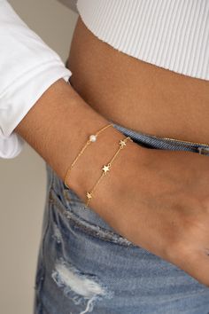 Such a cute star bracelet, featuring 6 star charms. This bracelet is great for stacking or on its own! Also makes for a special gift! THICK plating of 14k Gold or Rhodium over 925 Sterling Silver Available in 6.25" or 6.75" + .5" Ext Chain Lobster clasp closure Nickel-free & Hypoallergenic Dainty Adjustable Chain Bracelet With Star Charm, Everyday Star Charm Bracelet, Dainty Star Charm Bracelet, Adjustable Everyday Bracelet With Star Charm, Adjustable Everyday Bracelets With Star Charm, Adjustable Star Charm Bracelet For Everyday, Dainty Star-shaped Bracelets For Everyday Wear, Adjustable Charm Bracelet With Star Charm For Everyday, Adjustable Chain Bracelet With Star Charm As Gift