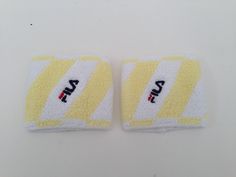 "Vintage wristbands by Fila Made in Italy 1980s Elastic sport wristbands in white color with yellow stripes. Classic Fila logo embroidered in the middle of the wrist. Deadstock item in new condition. In it's authentic packaging. One size Measurements: (1 inch = 2,54 cm) Width: 7cm - 2,7\" Please note that this vintage item is from time and it may have slight imperfections. For more details, product information or more photos, thank you to contact us." Sporty White Wristband For Sports Events, Casual White Wristband For Sports, White Casual Wristband For Sports, Adjustable White Wristband For Sports Events, Adjustable White Wristband For Sports, Adjustable White Sporty Wristband, Fila Vintage, Pucci Vintage, Vintage Tennis