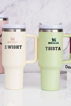 three travel mugs sitting next to each other on a white counter top with the words, i won't trista printed on them