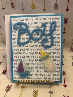 a card with some baby items on it