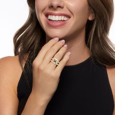 a smiling woman wearing a diamond ring