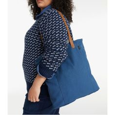 A classic market tote for errands or every day, in lightweight yet rugged canvas. They designed it with innovative leather handles so it's 100% machine washable. Specs: Dimensions: 15"L x 14"W x 3.5"D. Handle: 10.5". Capacity: Approx. 1,098 cu. in., 18 L. Weight: 0.8 lb. Fabric & Care: 60% recycled cotton, 40% cotton. Washed canvas fabric. Leather handles with grosgrain ribbon backing. Machine wash cold separately, no agitator, line dry. Construction: Single main compartment. One zippered pocket Casual Duck Canvas Tote Bag, Casual Duck Canvas Everyday Bag, Casual Everyday Duck Canvas Bag, Casual Weekender Tote Bag, Casual Duck Canvas Bag For Everyday Use, Casual Duck Canvas Bag For Daily Use, Everyday Weekender Bag With Double Reinforced Handles, Everyday Use Canvas Bag With Double Rolled Handles, Everyday Canvas Bag With Double Rolled Handles