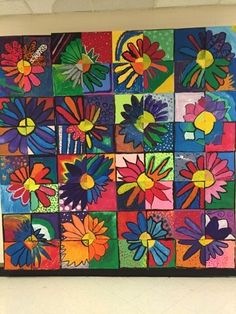 an art project with colorful flowers painted on the side of a wall in front of a window