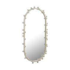 a white mirror with some balls on it