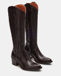 Expertly crafted for Western-style and durability, our SALOON boots feature a pointed toe, knee-high silhouette, and whipstitching detailing. The sturdy block heel with a star detail adds a touch of unique charm while providing comfortable support. Elevate your wardrobe with these timeless, versatile boots. 2.5 inch he Tall Pointed Toe Boots, Dark Brown Cowboy Boots, Brown Cowboy Boots Outfit, Tall Cowboy Boots, Knee High Western Boots, Cowboy Chic, Western Casual, Brown Cowboy Boots, Urban Cowboy