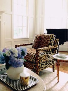 a living room filled with furniture and a piano