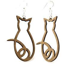 two wooden earrings with cats on them, one in the shape of a cat and another in the shape of a bird