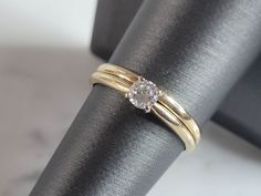 "A WOMENS VINTAGE ESTATE 14K GOLD DIAMOND RING .  THE SIZE OF THE RING IS A 7.75, AND WEIGHS 2.7g.  THEDIAMOND IS ABOUT .20cts.  THE WIDTH OF THE RING IS 1/8\".  RING IS MARKED \"14K\".  ANY OTHER QUESTIONS PLEASE ASK PRIOR TO BIDDING.  BE SURE TO CHECK OUT SOME OF MY OTHER GREAT ITEMS UP FOR SALE. THANK YOU" Classic Solitaire Stackable Rings For Anniversary, Heirloom Solitaire Stackable Rings For Anniversary, Vintage 14k Gold Stackable Rings For Formal Occasions, Vintage Yellow Gold Stackable Round Rings, Heirloom Solitaire Stackable Anniversary Rings, Formal Heirloom Stackable Rings Stamped 14k, Heirloom Stackable Rings For Formal Occasions, Classic Gold Solitaire Stackable Rings, Classic Gold Stackable Solitaire Rings