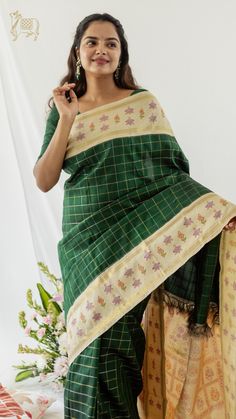 This Bottle green Kanchipuram saree has beautiful block printed flower patterns on its butter white border and pallu, making it look very elegant. The body of the saree has veldhari checks patterns,t  hat exudes elegance. Green Kanchipuram Saree, Sarees For Wedding, Vermillion Red, Checks Saree, Silk Sarees Online Shopping, New Saree Designs, Bridal Silk Saree, Kanjivaram Sarees, Kanchipuram Silk Saree