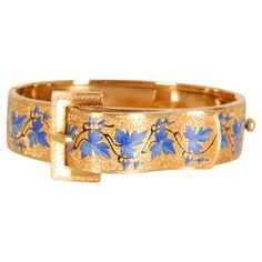 Unique antique Victorian bangle bracelet with buckle and enamel. Hand crafted in solid 14k gold and absolute fabulous blue enamel. A wide design covered with incredible textured work throughout, and adorned with a fine and blue enamel with grape leaf patterns. The yellow gold with the buckle and enamel blue gives it an attractive and elegant touch. The bracelet is securing with a sturdy push clasp. The antique bracelet has been preserved very well and has a gorgeous yellow gold appearance. A ver Luxury Traditional Blue Cuff Bracelet, Luxury Victorian Gold Collectible Bracelet, Leaf Patterns, Grape Leaf, Antique Bracelets, Buckle Bracelet, Enamel Bracelet, Unique Antiques, Gold Floral