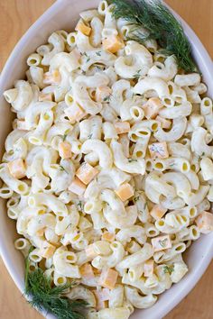 a white bowl filled with macaroni and cheese