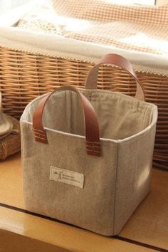 a basket sitting on top of a wooden table