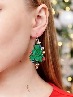 In the Holiday Spirit Christmas Tree Earrings It’s beginning to look a lot like Christmas with these festive holiday earrings. Merry and bright, we’ll take these fabulous firs over an ugly sweater any day. The earrings are designed with pompom Christmas trees topped with metallic ornaments, and a star, of course. Put a pair in the stocking of everyone you celebrate and unwrap gifts with. Size: 5 cm Material: soft fluffy synthetic fabric balls, alloy steel brass zinc, plastic beads Weight for 2: Fabric Balls, Christmas Tree Tops, Bell Design, Holiday Earrings, Christmas Tree Earrings, Jewelry Care Instructions, Christmas Tree With Gifts, Holiday Earring, Earring Tree