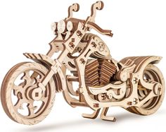 a wooden model of a motorcycle on a white background