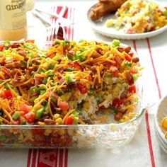 a casserole dish is loaded with vegetables and cheese on the top, ready to be eaten