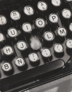 an old fashioned typewriter sitting on top of a table