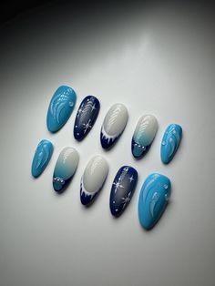 3D Blue and White Press On Nails made for you. In the picture - almond nail shape.   Very high quality and will last you up to 2 weeks. After right removal can be reusable. Just choose the shape and length of the nail you would like and choose the size of your nail bed, or choose the option - custom.  I highly recommend to purchase my Nail Sizing Kit from my page to make sure they fit perfectly before purchasing any designed Press On Nails Icy Blue And White Nails, Blue And White Nails Winter, Blue Christmas Nail Art, Blue Christmas Nails Almond, Blue And White French Nails, Almond Nails Designs Blue, Navy Blue Christmas Nails, Almond Nails Designs Winter, Dark Blue Christmas Nails