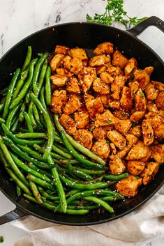 chicken and green beans in a skillet