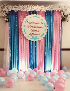 a welcome to grandma's baby shower backdrop with blue, pink and white balloons