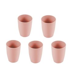 six pink cups sitting next to each other on a white surface