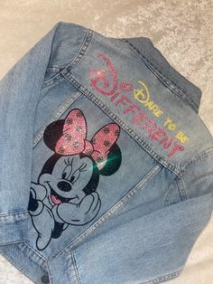 Custom Handmade denim jacket. Perfect for birthday parties, photos, gifts, etc. Vibrant colors and  crystals makes this jacket eye catching! The jacket comes standard with the crystal name and the Minnie mouse head with the crystal hair bow on the back  the initial with the bow in the front are extra This item will most likely take the 3 weeks unless I advise you that it won't because the crystals and everything needs time to properly dry  before it is sent out Allow 2-3 weeks for all custom orders. Please send a message for special request and/or add one. Disney Painted Jean Jacket, Minnie Mouse Head, Kids Jeans Jacket, Diy Outfits, Fabric Paint Diy, Fotos Ideas, Disneyland Outfits, Paint Diy, Custom Denim