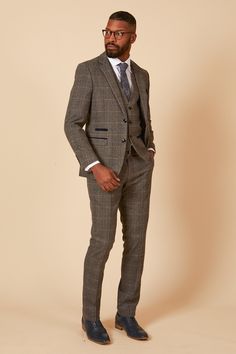 Spruce up in the Scott three piece suit. This vintage inspired suit draws inspiration from old age country tweeds featuring a subtle check laid upon a durable heavyweight fabric. Character is added with the navy velvet contrast pocket trims and an eye-catching blue paisley pocket square peeking through the top pocket. Model wears size 40R blazer, 40R waistcoat & 34R trousers. Features Slim fit Single-breasted Notch lapel Single back vent Four button cuff Double button blazer fastening Waistcoat Tailored Tweed Three-piece Suit, Tweed Three-piece Suit For Semi-formal Occasions, Semi-formal Tweed Three-piece Suit, Semi-formal Three-piece Tweed Suit, Tailored Tweed Three-piece Suit Single Breasted, Tailored Tweed Single-breasted Three-piece Suit, Tailored Plaid Tweed Jacket With Suit Collar, Single Breasted Tweed Three-piece Suit, Tailored Plaid Tweed Jacket